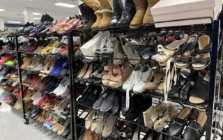 Women’s clothing – Shoe rack Women's shoes display at Goodwill